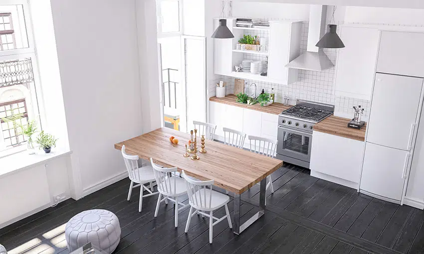 Kitchen and dining with white paint black wooden floor range hood white fridge