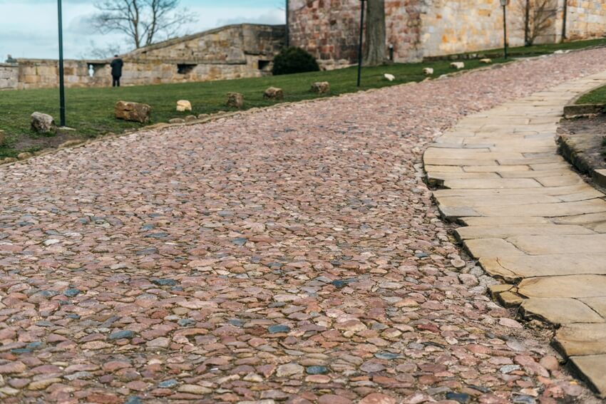 Ancient colorful paving stone along the walkway path