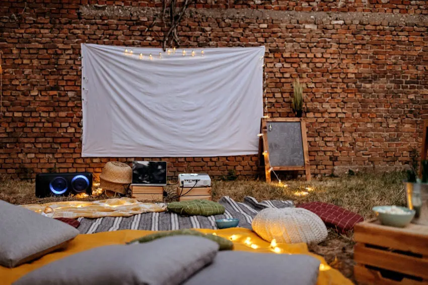 Backyard with projector screen pillows outdoor movie