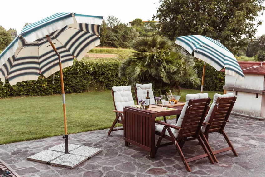 Backyard with table chairs and outdoor shade