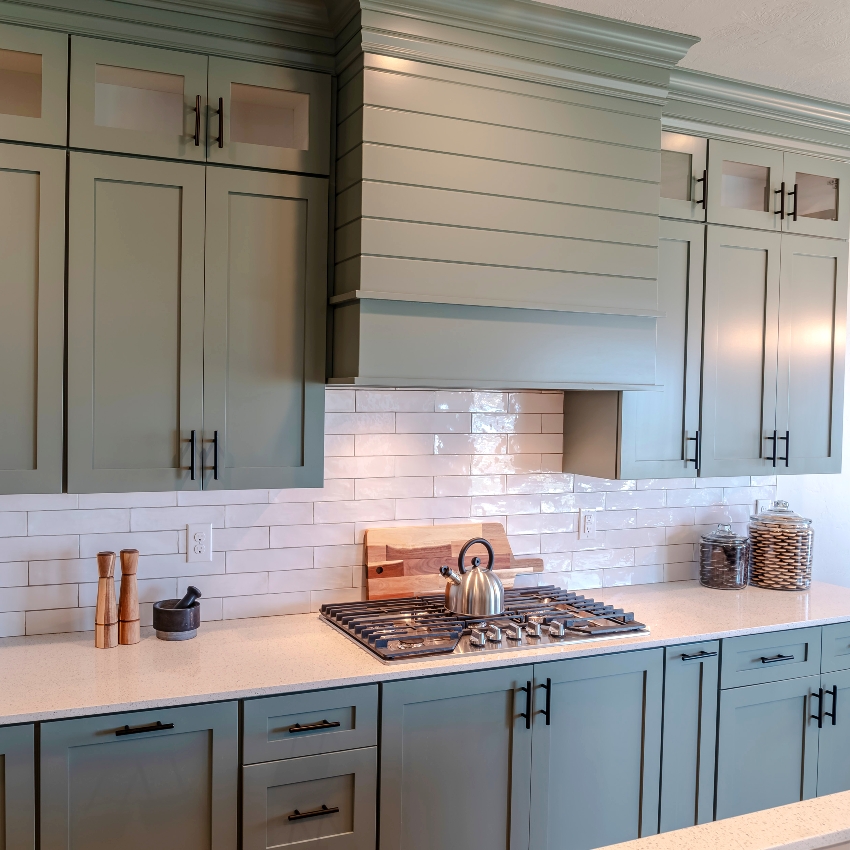 Kitchen with green matte finish cabinets