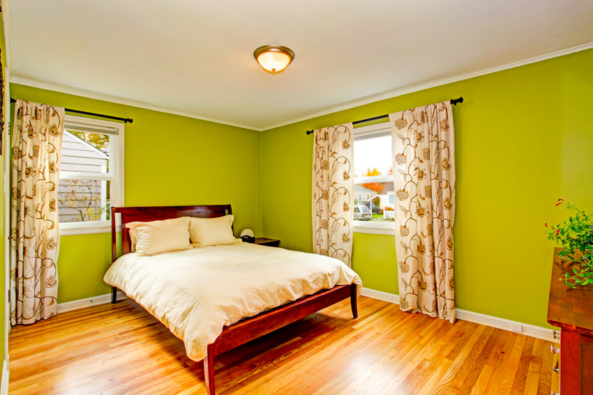 Bedroom with lime wall curtain wood flooring