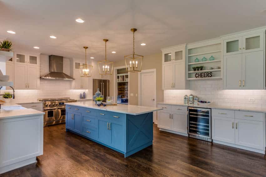 Blue kitchen island with centerpiece wood flooring pendant lights white cabinets