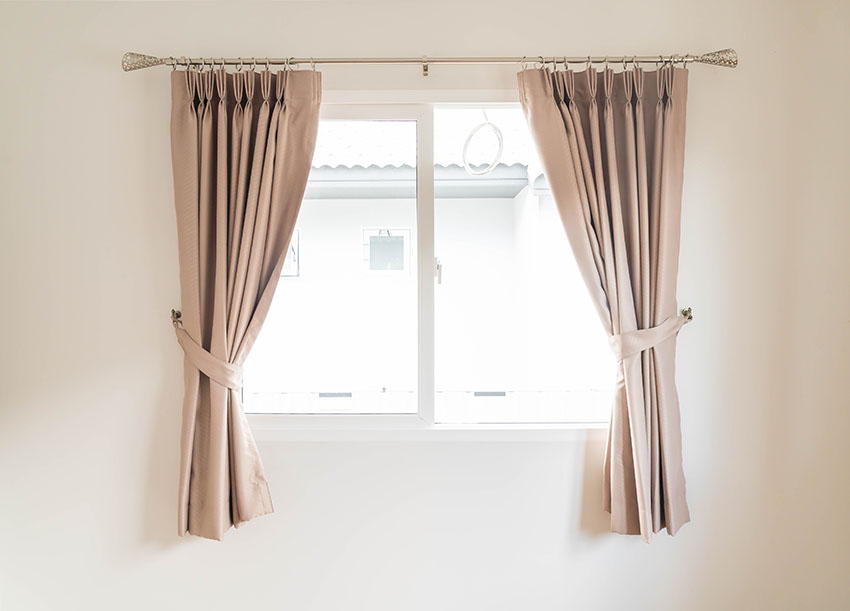 Brown curtain with metal rod