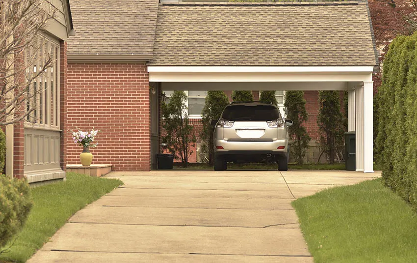 Carport attached to house with parked car