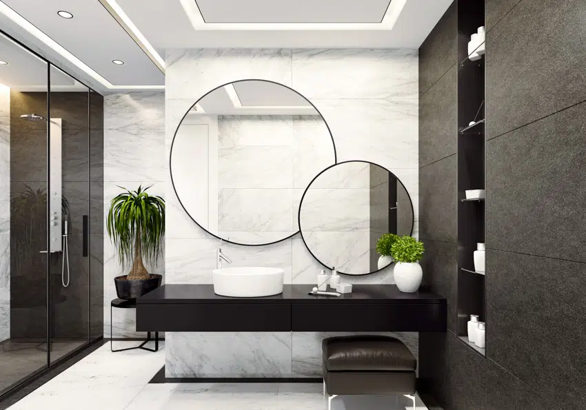 Contemporary bathroom with round mirrors concrete gray wall countertop sink indoor plants