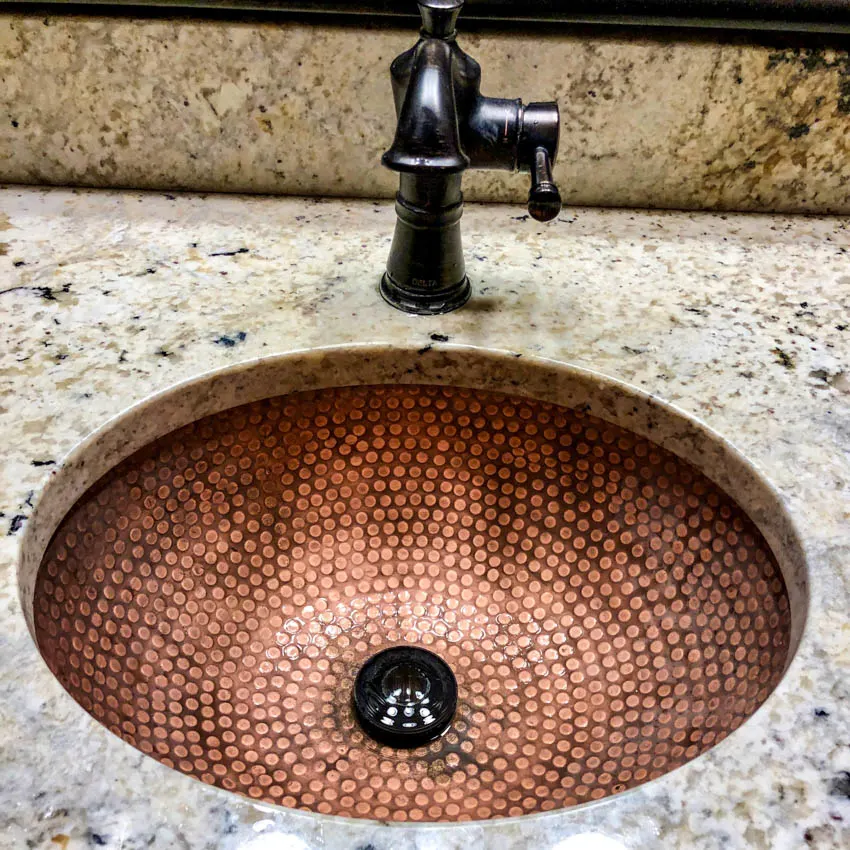 Copper sink with pattern marble countertop black faucet