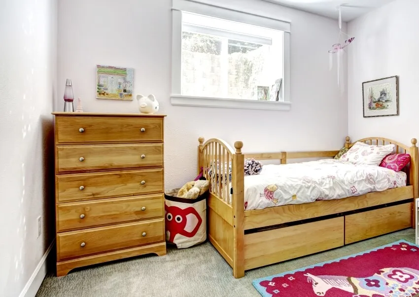 Cozy kids room with rustic bed and dresser