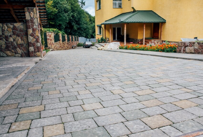 Driveway pavers in vintage design flooring square pattern texture on the ground of street road