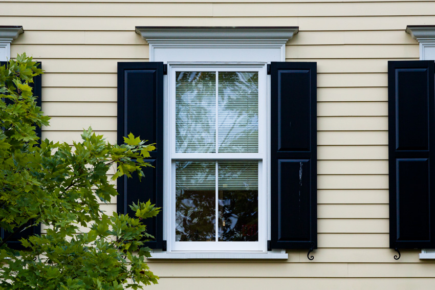 Exterior panel shutters and glass window