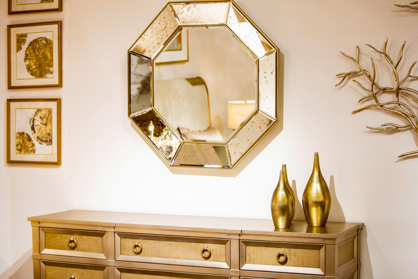 Golden framed mirror decor piece