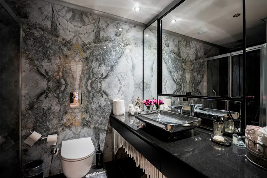 Gray and black bathroom mirror countertop toilet