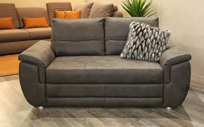 Gray two person recliner sofa with pillow