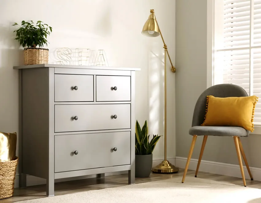 A grey chest of drawers in stylish scandinavian room interior