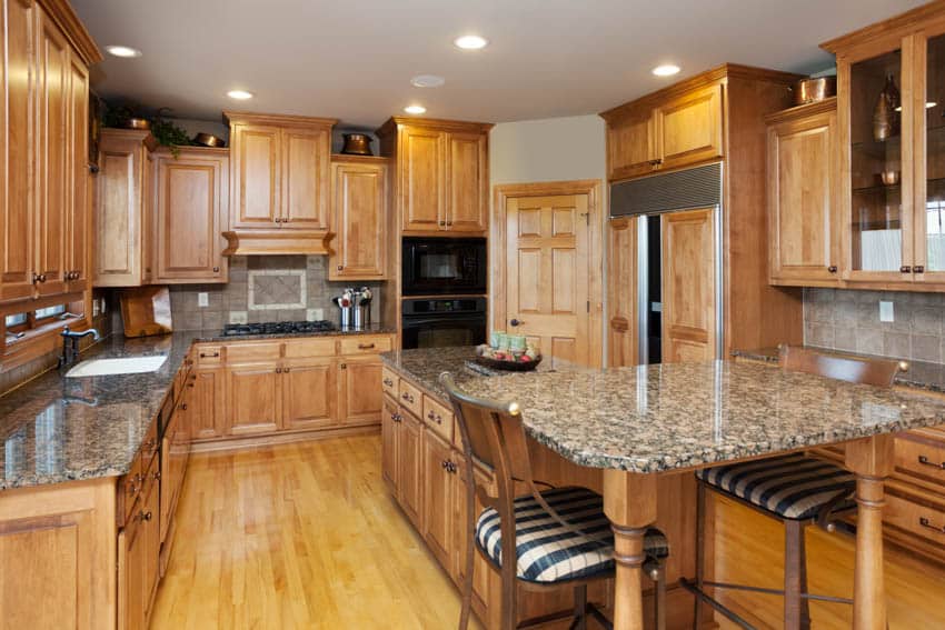 Large kitchen with island for dining countertop maple cabinets