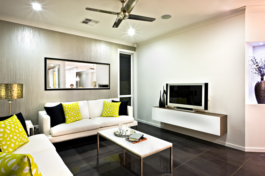 A wide mirror on a metallic accent wall 