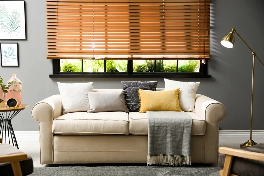 beige sofa with printed cushion