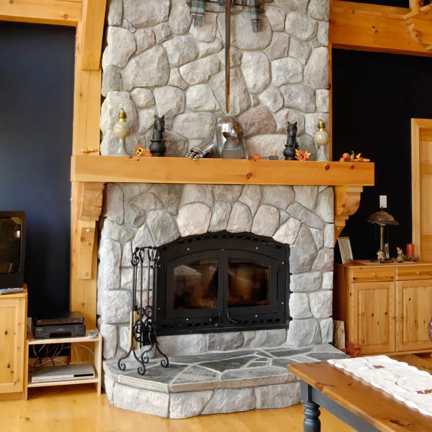 Log cabin with blue walls stone fireplace