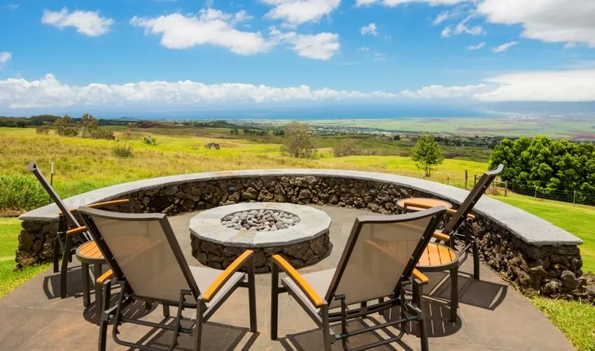 Luxury backyard fire pit with metal outdoor chairs