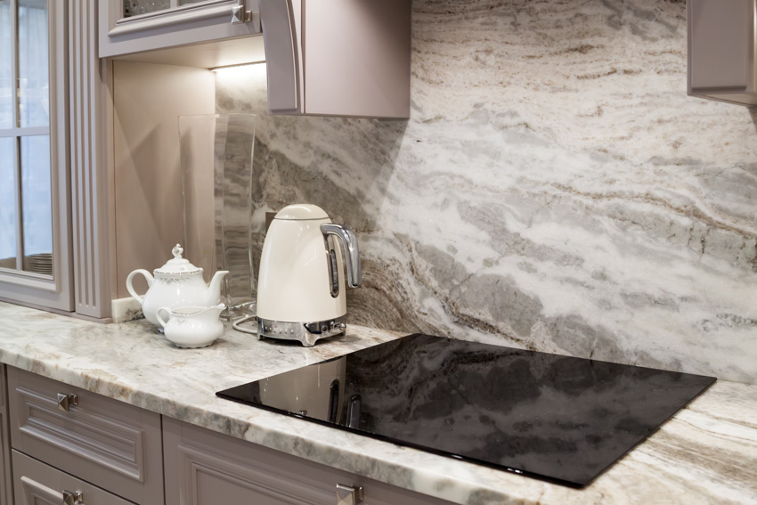 Marble countertop backsplash and electric stove