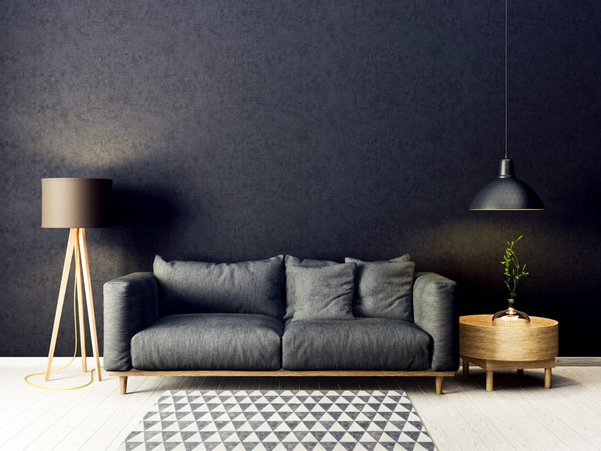 Black sofa and hanging light lamps