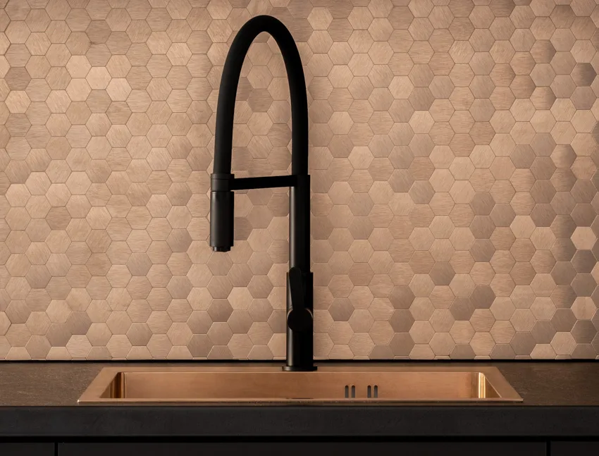 Copper tile with black faucet