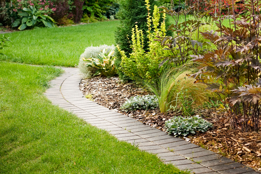 Narrow walkway constructed of faux bricks