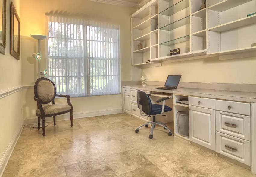 Office area with travertine surface, shelves drawers and cabinets