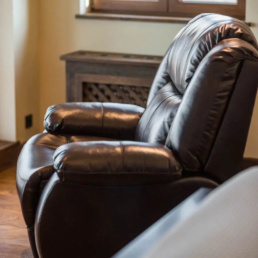 Recliner with brown leather inside living room