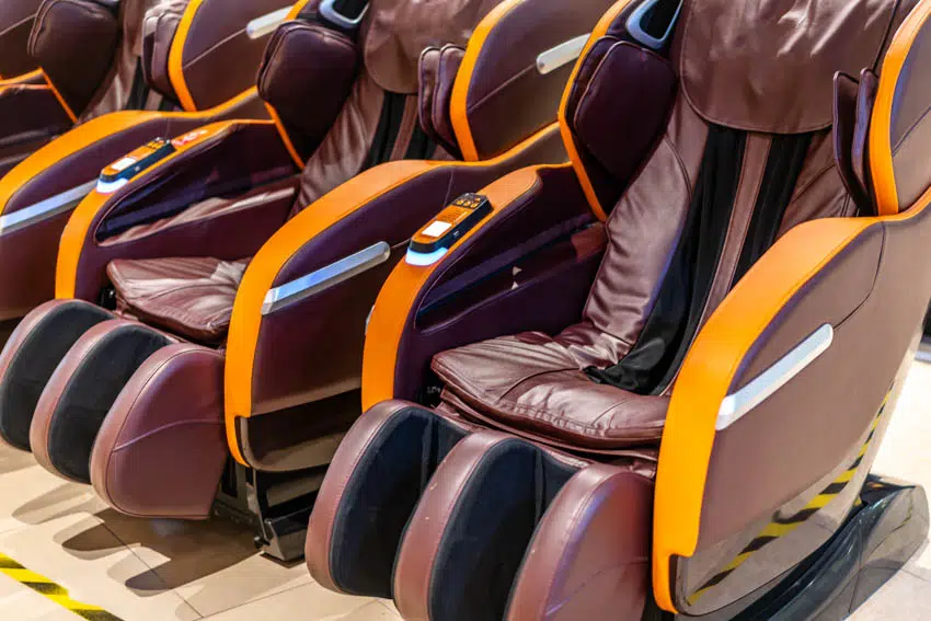 Reclining chairs with massage feature