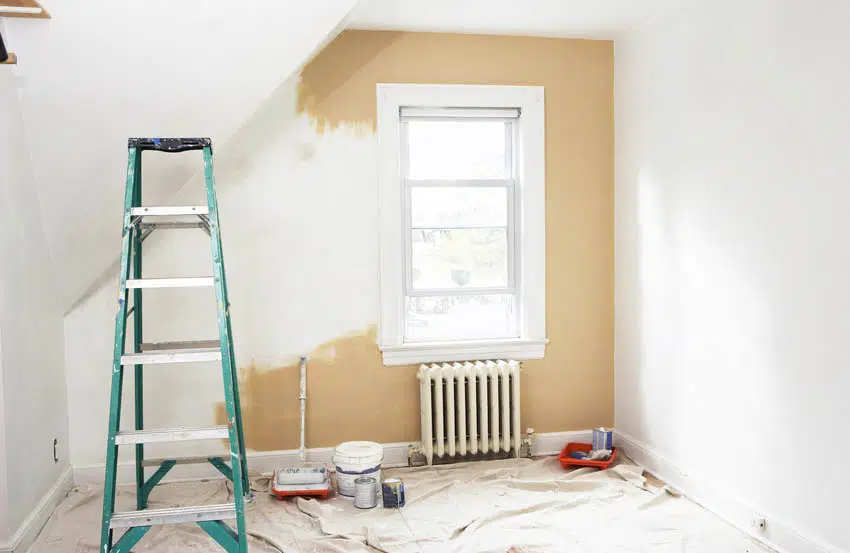Room renovation with painting materials and ladder