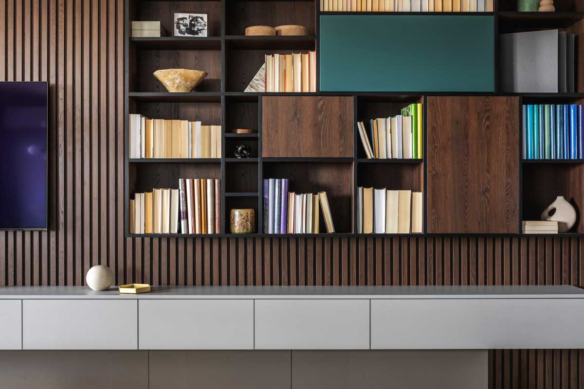 room with wall mounted bookcase and slatwall design