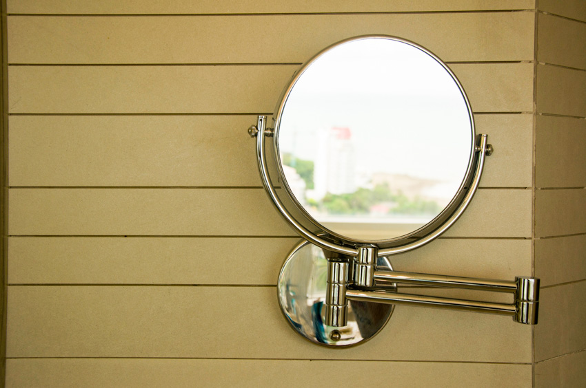 Wall mounted makeup mirror