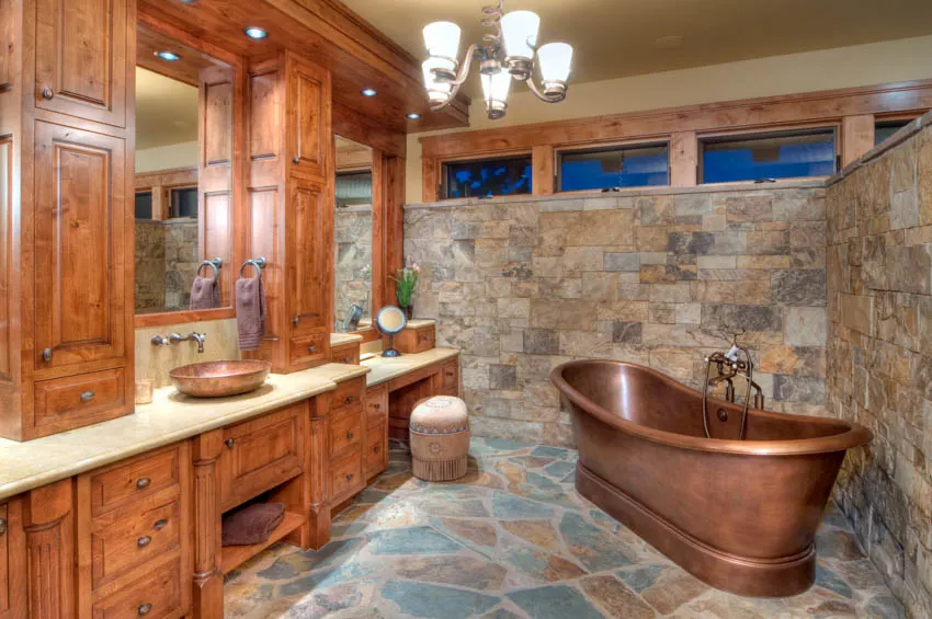 Slate tile floor wood cabinet bathroom mirror copper sink bathtub