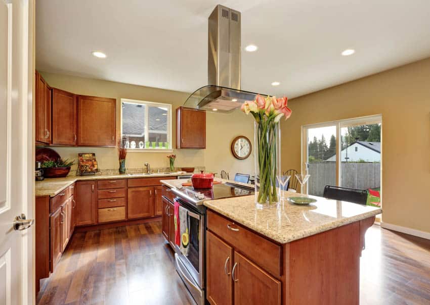 Spacious kitchen with island centerpiece wood cabinets floors drawers glass door