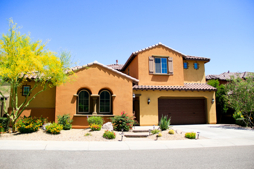 Spanish style house with red and orange exterior paint color