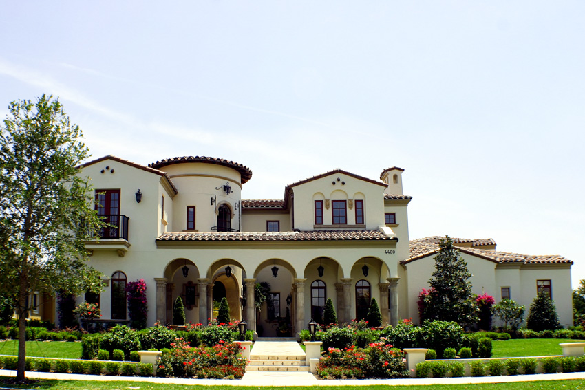 Spanish style house with white exterior paint color