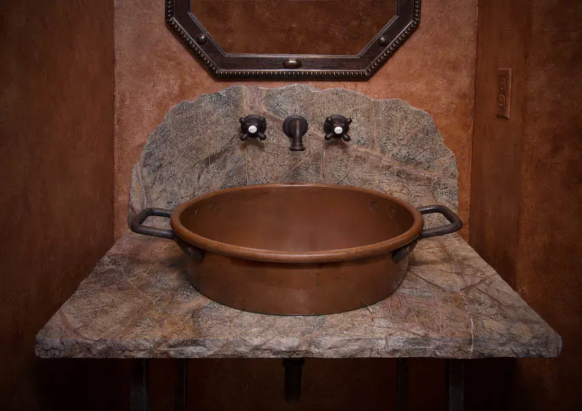 Stone and copper sink bathroom mirror