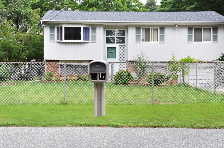 Suburban home with chain style fencing