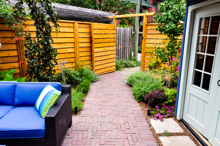 Outdoor sofa and brick laid around home