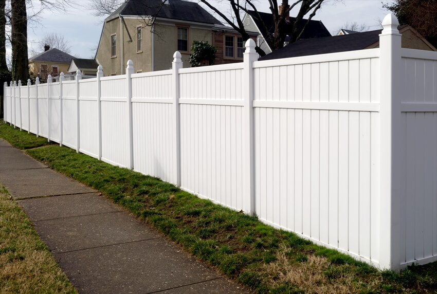 White vinyl fence in residential neighborhood