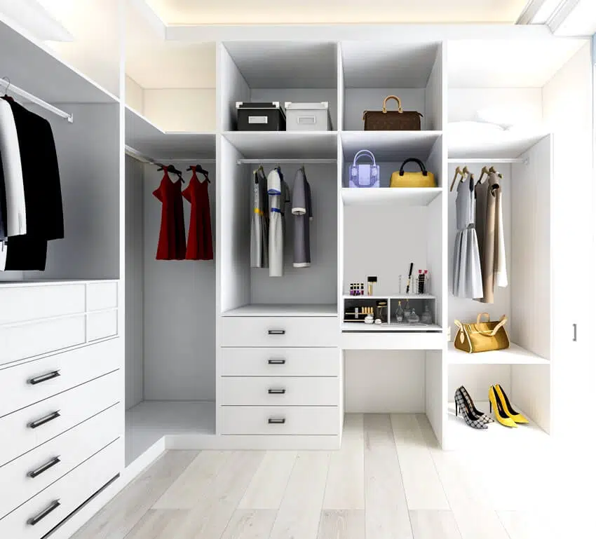 White closet with clothes shoes and bags
