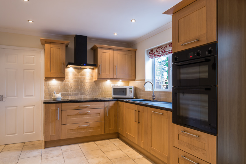 Wood cabinets drawers countertop backsplash