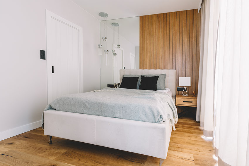 Bedroom with wooden floor white paint