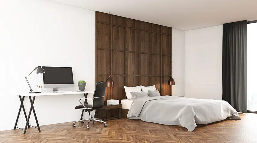 Bedroom with wooden herringbone pattern tiles white paint portable desk