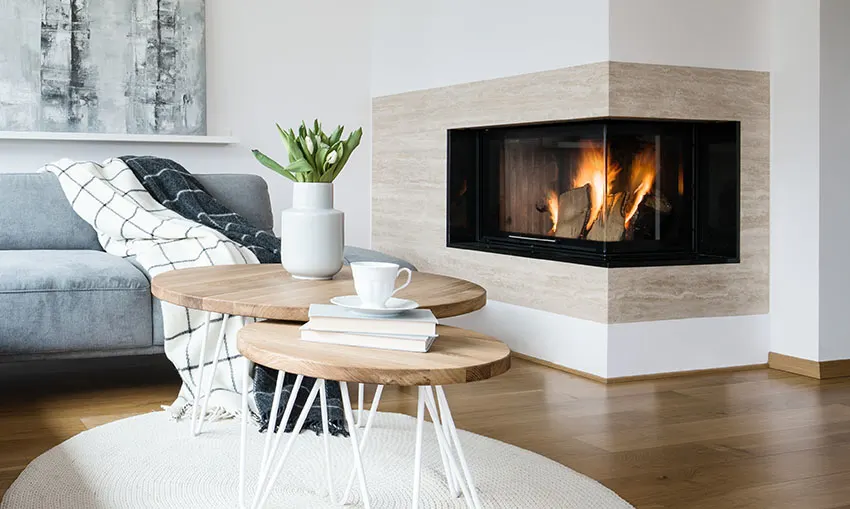 Double sided fireplace with coffee table white paint