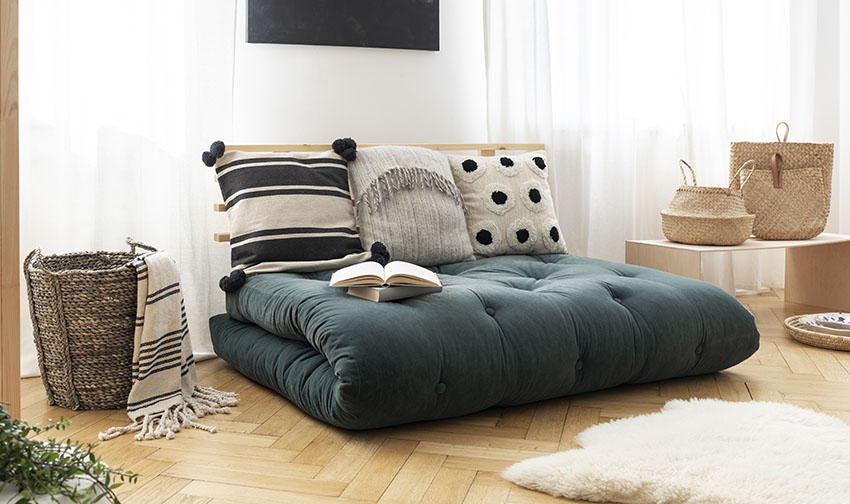 Mattress sofa with herringbone wood flooring and baskets