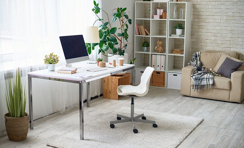 Modern Scandinavian interior design room with metal frame desk rug shelves brick wall
