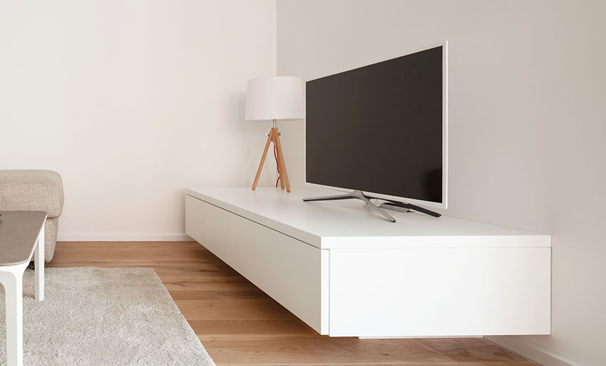 TV with white rack and lampshade