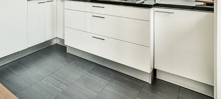 White kitchen cabinet charcoal tile
